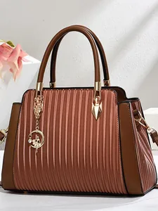 Fashionable brown pleated tote bag for women with gold moon charm and double handles