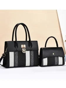 Women striped tote bag set with black and white woven pattern and golden hardware