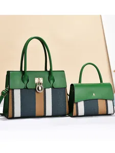 Green leather and striped fabric tote bag set with round lock and shoulder strap