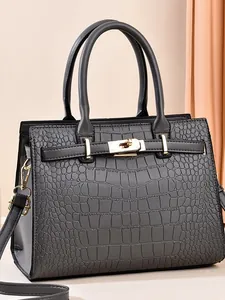Minimalist dark gray crocodile embossed handbag with gold lock and dual handles