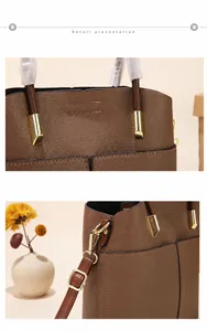 Detailed macro view of brown lychee grain leather handbag with gold metal hardware