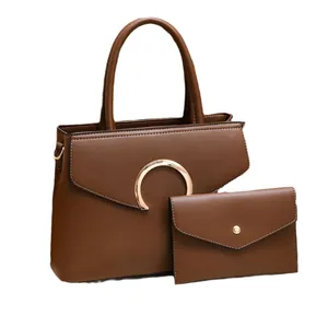 Brown leather handbag set for women including tote and envelope clutch bag