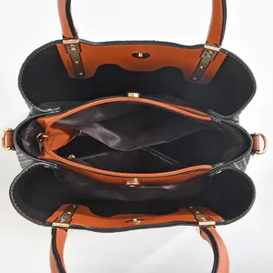 Internal structure of large capacity handbag with three compartments and golden hardware