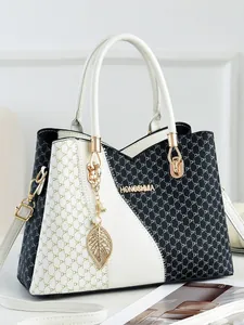 Black and white contrast women's handbag with DH monogram and pearl leaf charm