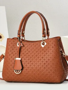 Brown woven texture tote bag with gold-tone hardware and elegant dual handles
