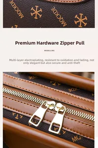 Close-up of premium gold-tone dual zippers and embossed pattern on brown leather bag