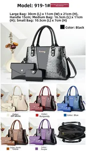 Detailed view of luxury snakeskin texture tote bags with metal logos in diverse sizes