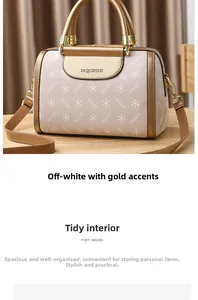 Close-up of pebble grain PU leather Boston bag with snowflake patterns and gold hardware