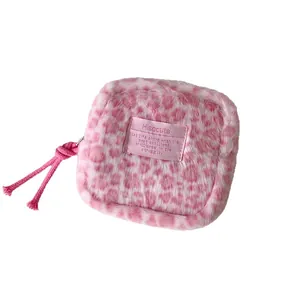 Pink leopard print plush makeup bag with a zipper and convenient rope pull handle