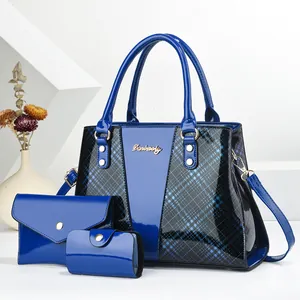 Detailed view of 3-piece navy blue shiny patent leather tote bag set with plaid accents