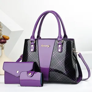 Detailed view of luxury purple 3-in-1 handbag set featuring shiny grid pattern and gold logo