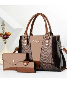 Three-piece brown snakeskin pattern tote bag set with matching wallet and pouch