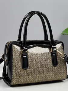 Luxury black patent leather Boston handbag with gold sequin panels and gold hardware