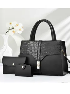 Three-piece black tote bag set with crocodile texture, metal lock, and gold snaps