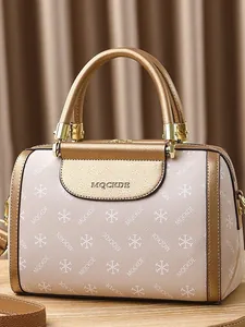 Elegant Boston handbag with MQCKDE print and champagne gold metallic accents