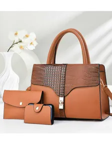 Three-piece brown tote bag set featuring crocodile texture and gold hardware detailing