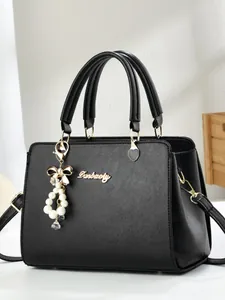 Classic black Saffiano leather handbag with gold Danbaoly logo and pearl charm