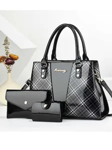 Three-piece black patent leather handbag set with plaid side panels and gold logo