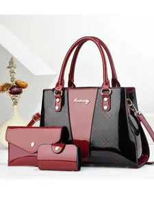 Three-piece retro patent leather handbag set in burgundy and black with gold hardware