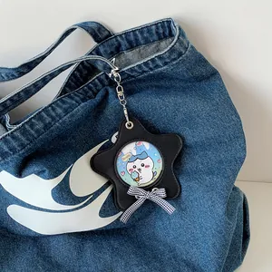 Portacarte a forma di stella in pelle PU con fiocco appeso a una borsa di jeans