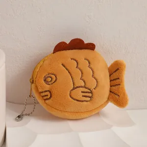 Detailed view of plush taiyaki coin purse with soft texture and golden zipper