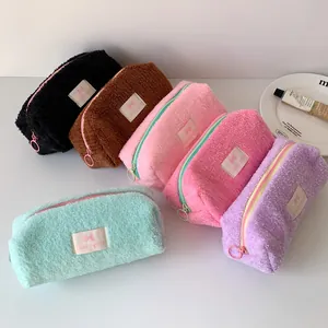Group shot of colorful fluffy faux fur stationery pouches in six vibrant pastel colors