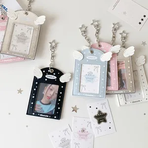 Detail of angel wing PU card holders with star buckles in five pastel colors
