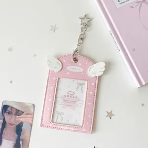 Detailed view of pink PU leather card holder with angel wings and star clip