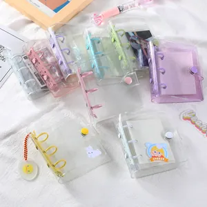 Macro view of mini 3-hole PVC binder with glitter texture and colorful macaron rings