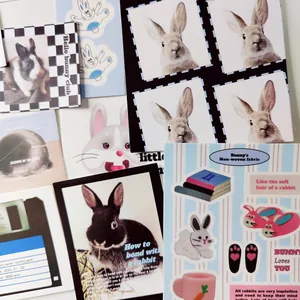 Flat lay of retro bunny club stickers and creative stationery cards for DIY scrapbooking