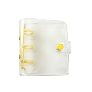 Mini 3-hole clear PVC binder with vibrant yellow rings and snap button closure