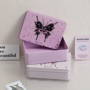 Macro shot of rectangular metal tin boxes with butterfly prints and rounded edges