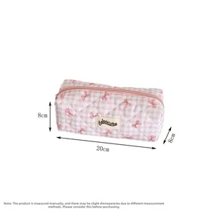 Detailed size view of pink checkered pencil case with bow print and hisocute label