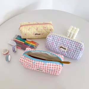 Quilted checkered pencil pouch with pink bow prints in yellow, purple, and pink colors