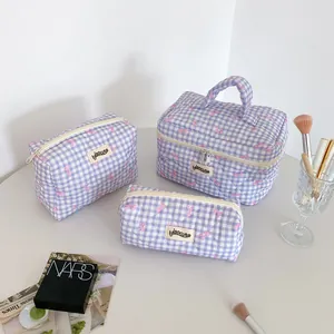 Detailed view of lavender gingham quilted stationery pouch set with pink bow pattern