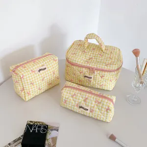 Three-piece cream checkered stationery bag set with bows and quilted cotton texture