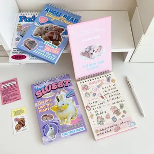 Detail of spiral-bound weekly planners featuring cute animal illustrations and task layouts