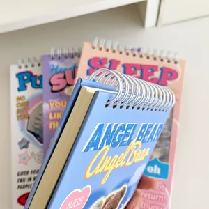 Detail of white metal spiral binding and thick paper on Angel Bear weekly planner