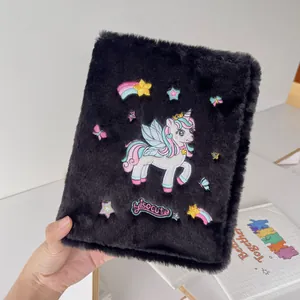 Detail of black plush A5 binder with rainbow unicorn embroidery and soft fur texture
