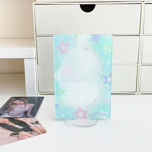 Detail of light blue gradient acrylic photo stand with stars for desktop display