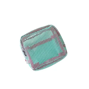 Mint green mesh square organizer bag with vibrant red lining and zip closure