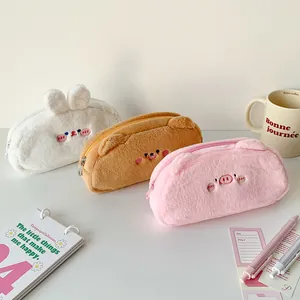 Detail of plush animal pencil cases showing soft faux fur and embroidered cute faces