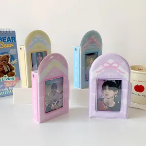 Detail view of colorful bow-knot PVC photo albums in yellow, pink, blue, and purple tones