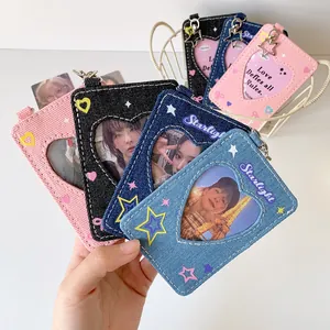 Macro detail of Y2K denim heart-shaped card holders with star charms and metal clips