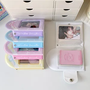 Detail of colorful PVC photo albums with metal snap buttons and transparent card pockets
