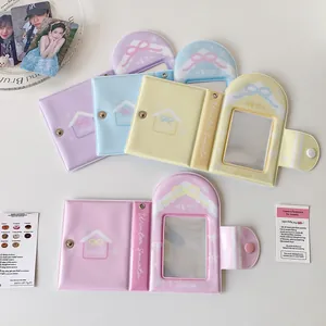 Detail of macaron-colored PVC photo card holders with bow patterns and button closure
