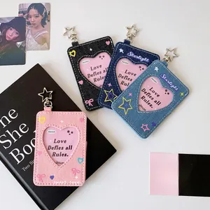 Detail of denim heart-shaped photocard holder with star metal buckle in various colors