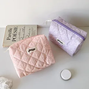 Quilted cotton makeup bags with ink splash patterns in pink and purple colors