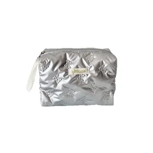 Silver quilted cosmetic bag with embossed butterfly pattern and top zipper closure