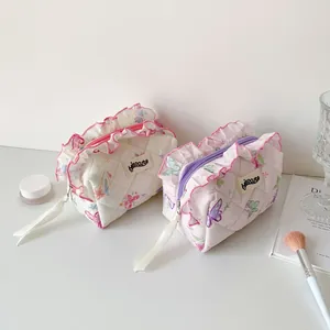 Quilted butterfly cosmetic bag with elegant ruffles and secure zipper closure